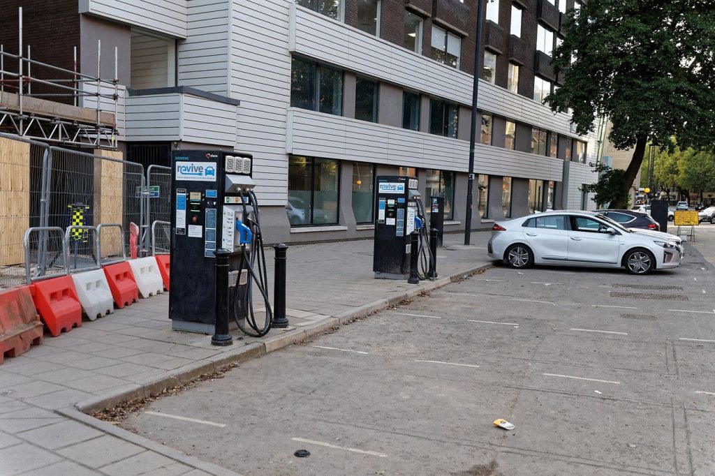 Curbside EV Charging Solves the No-Driveway Problem An electric car charging on a city street